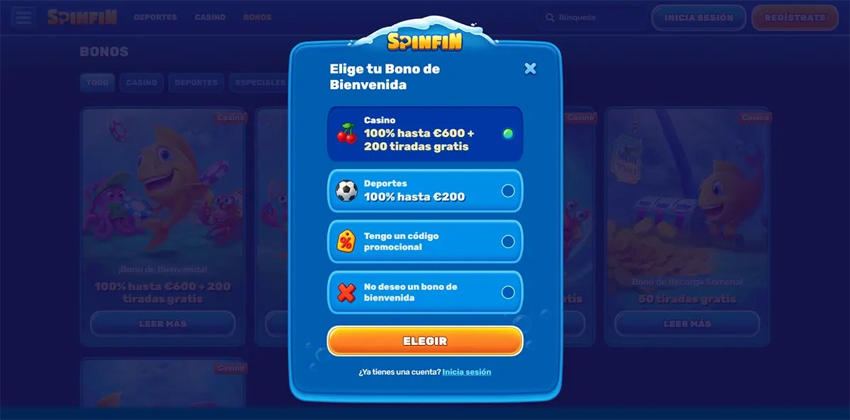 Welcome bonus selection modal (Spanish localisation) for Spinfin Casino, allowing users to choose between a casino bonus (100% hasta €600 + 200 tiradas gratis), a sports bonus (100% hasta €200), entering a promo code, or declining the bonus, with a prominent “Elegir” button and login option below