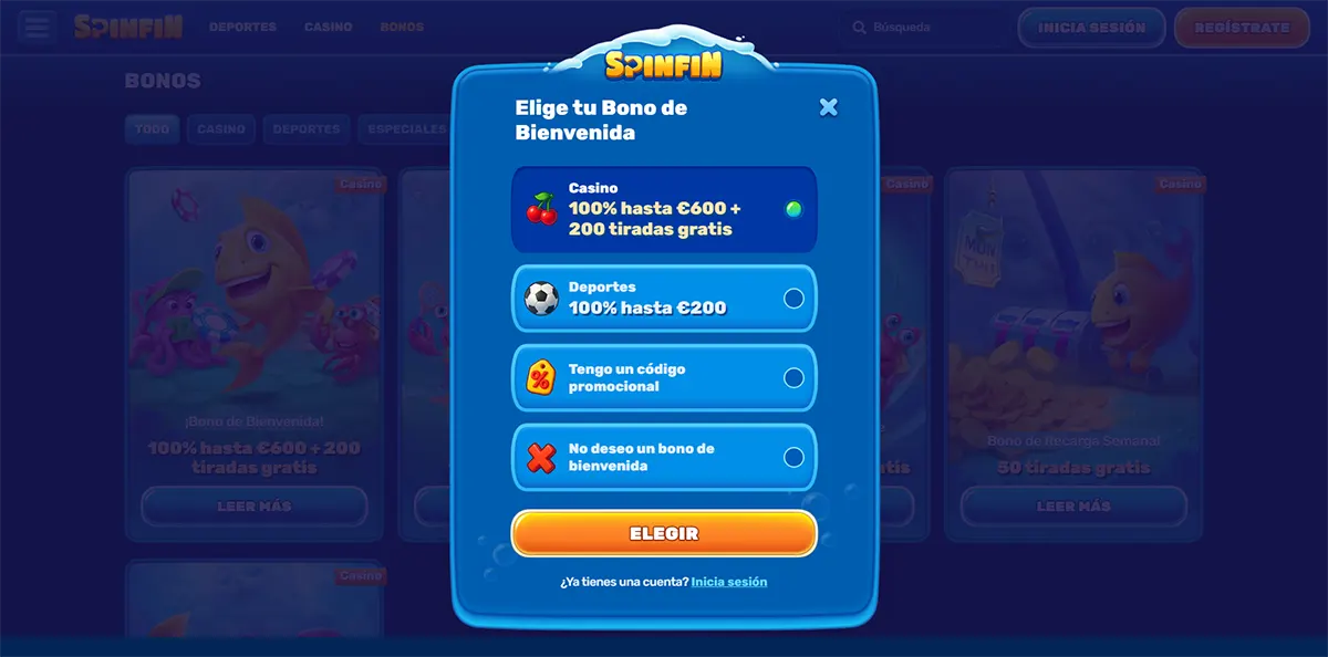 Welcome bonus selection modal (Spanish localisation) for Spinfin Casino, allowing users to choose between a casino bonus (100% hasta €600 + 200 tiradas gratis), a sports bonus (100% hasta €200), entering a promo code, or declining the bonus, with a prominent “Elegir” button and login option below
